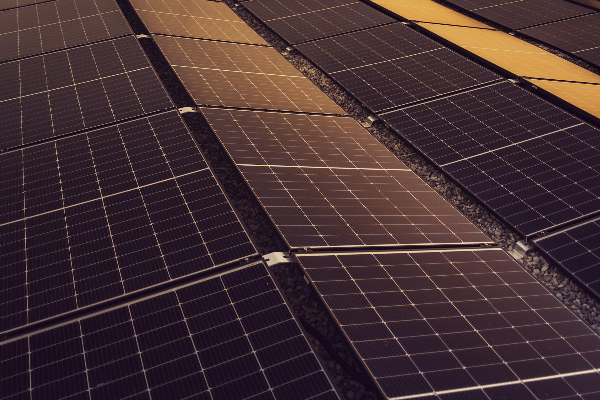Rooftop solar array above the Amber Petroleum forecourt, Tier 1 panels over fire-safety-engineered mounting